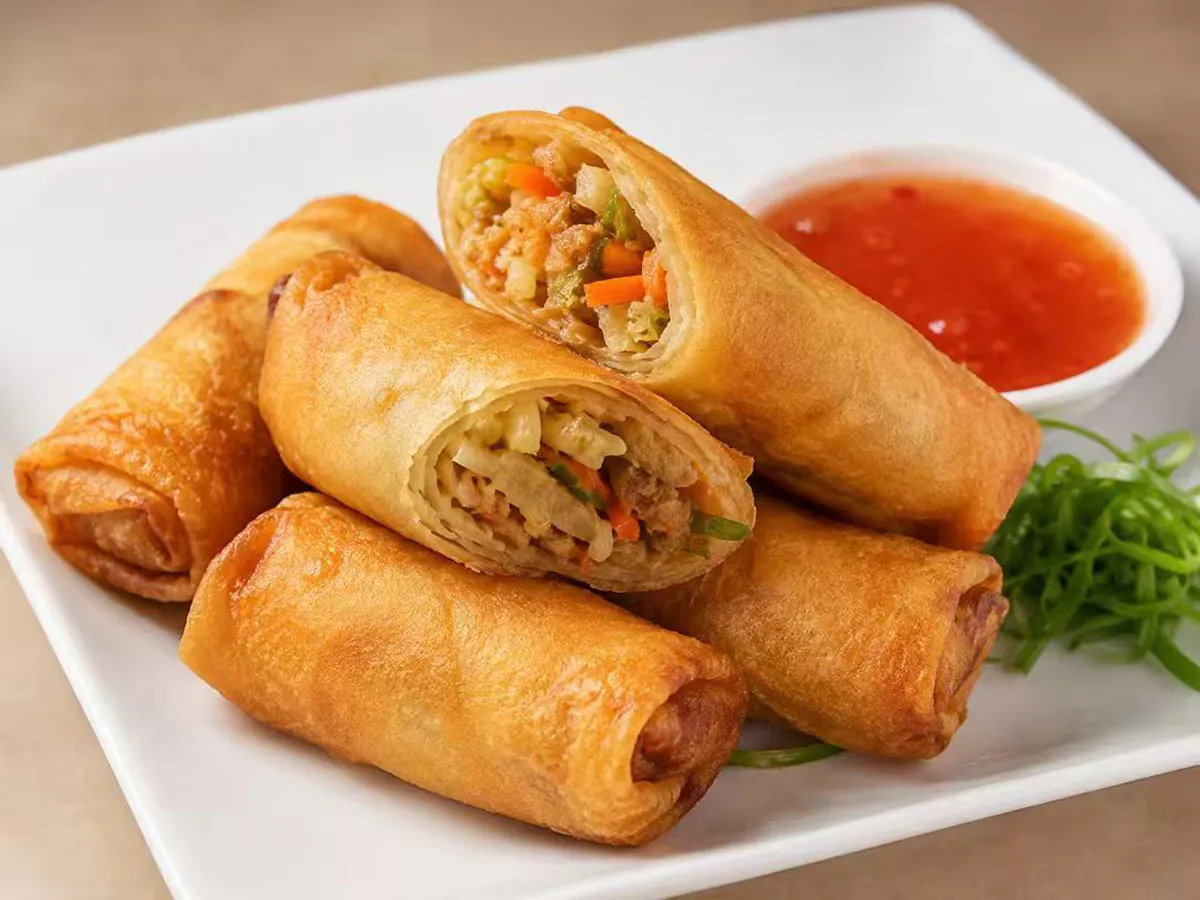 Crispy egg rolls with dipping sauce at Mei's kitchen, a Chinese Restaurant in Knoxville